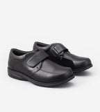Pair of black shoes with velcro straps on a white background