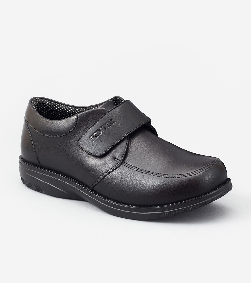 Black shoe with a strap on a white background