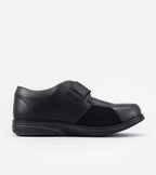 Black leather slip-on shoe on a white background