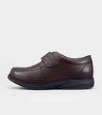 Brown running shoe on a white background