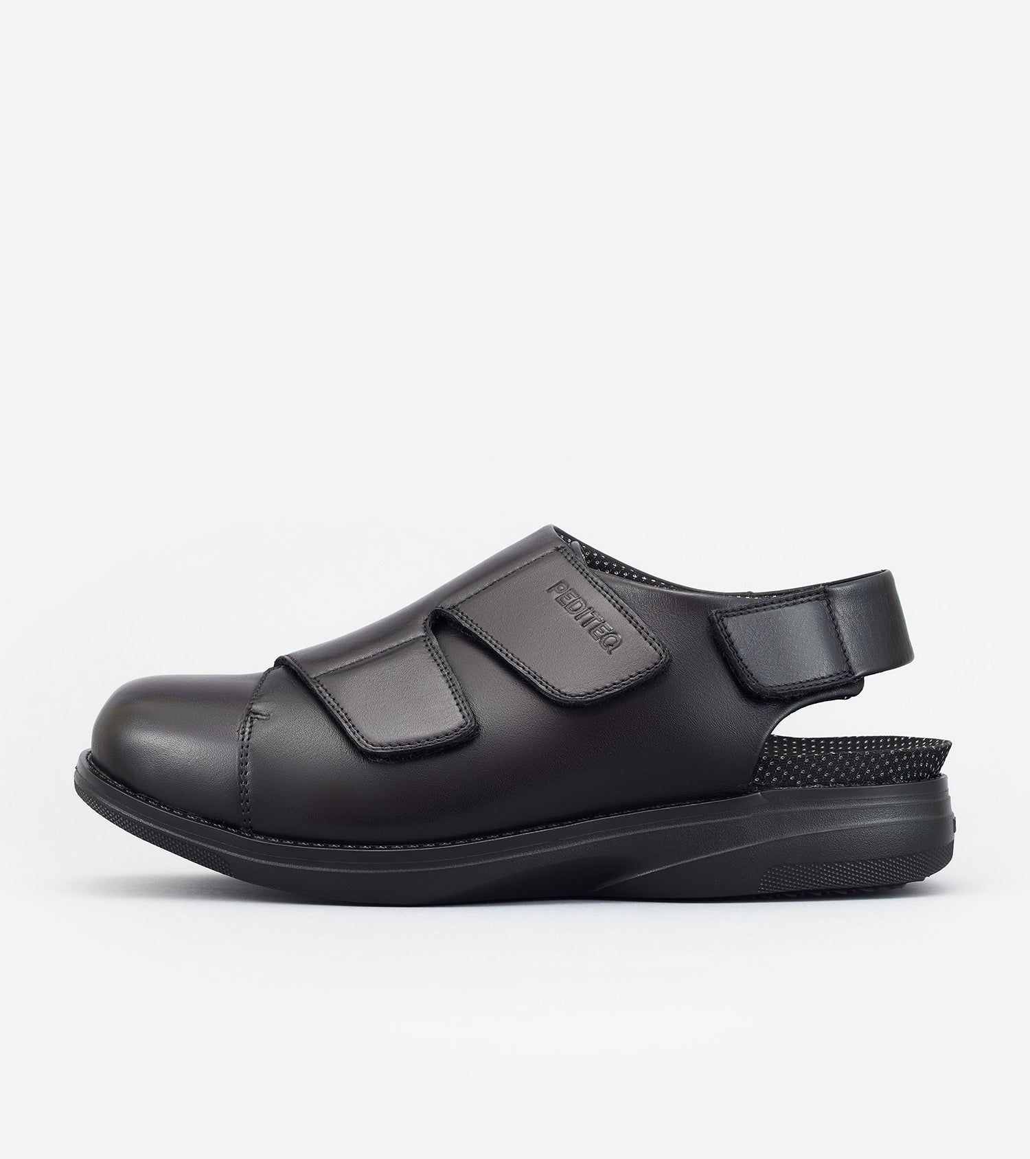 Black shoe with velcro straps on a white background