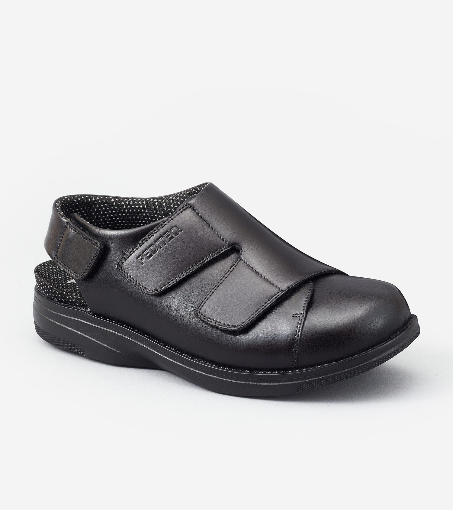 Black shoe with velcro straps on a white background